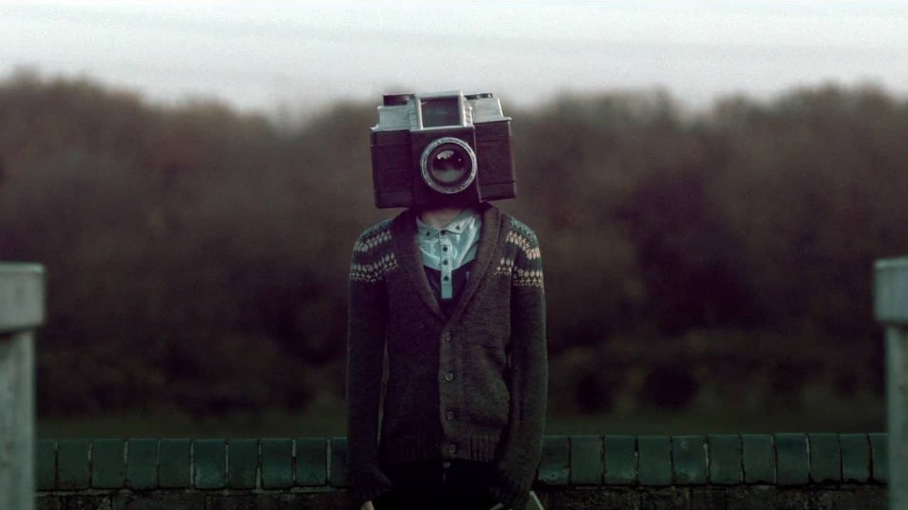 The Boy with a Camera for a Face backdrop