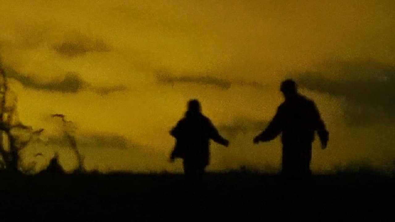 Figures Around a Fire backdrop