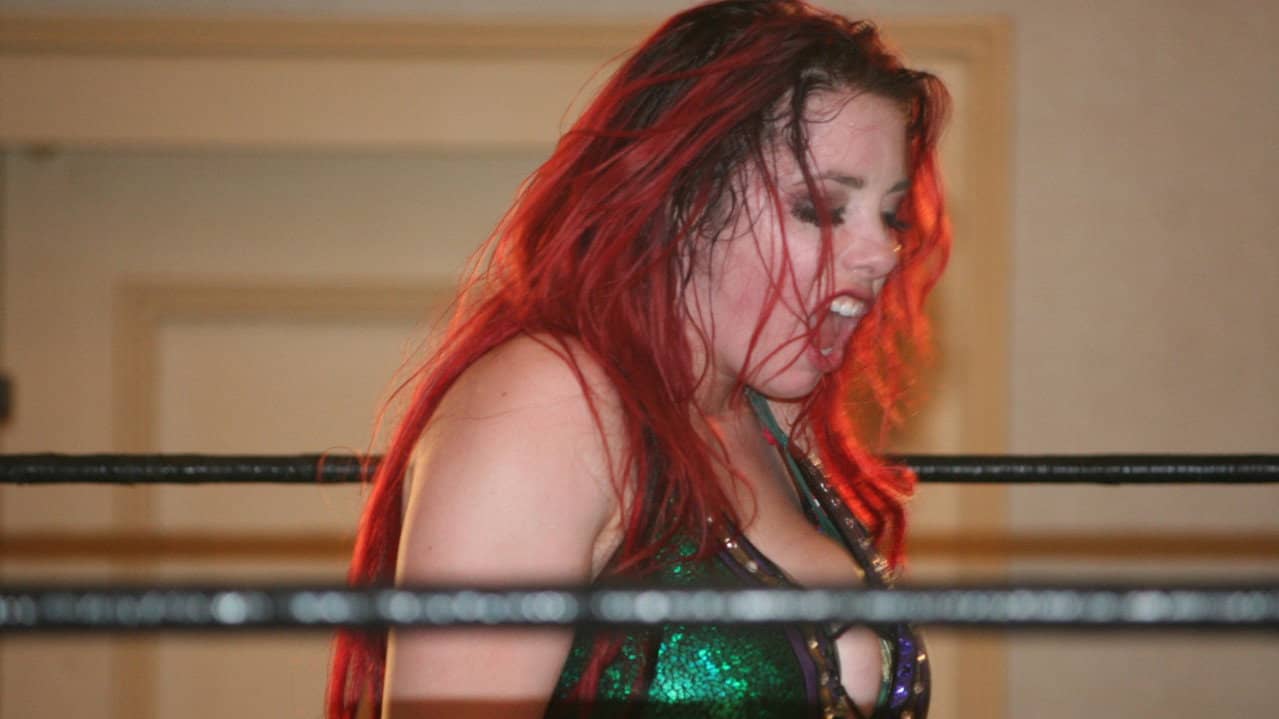 Queens Of Combat QOC 13 backdrop