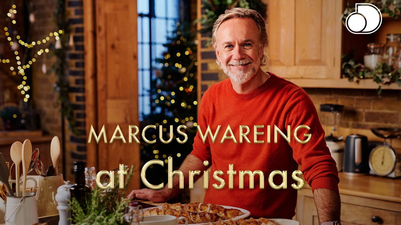Marcus Wareing at Christmas backdrop