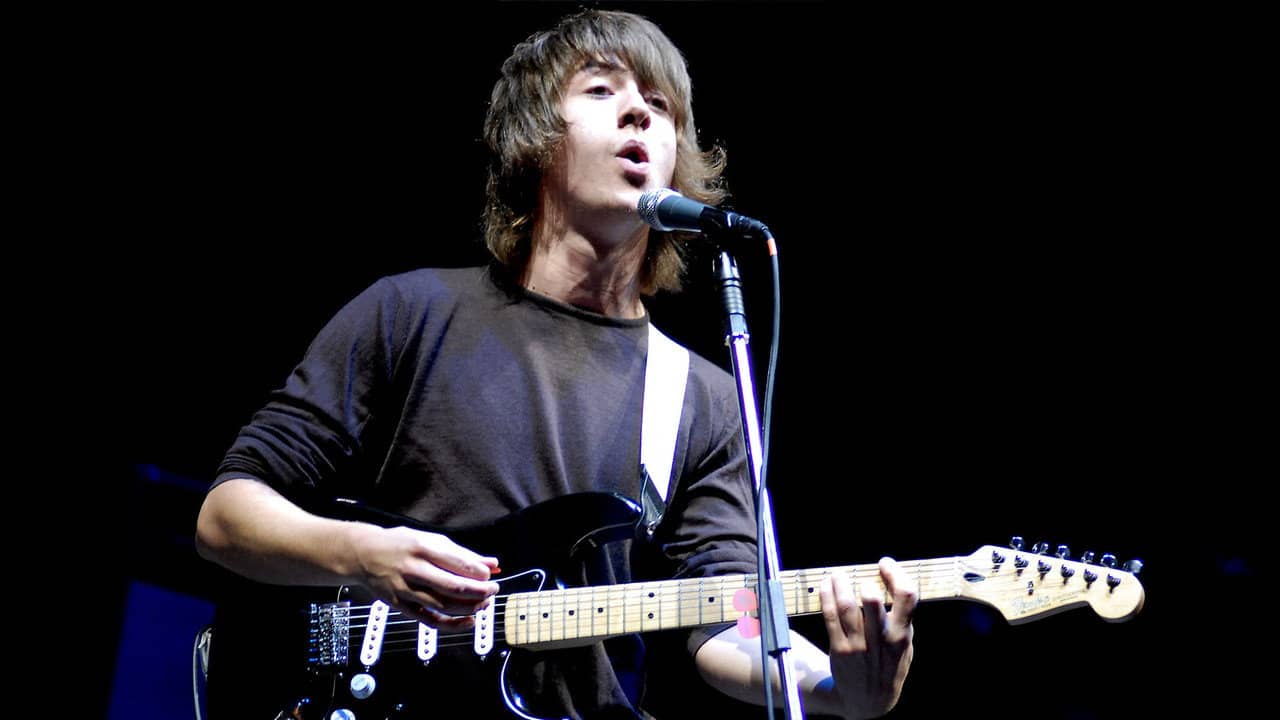 Arctic Monkeys: Behind the Music backdrop